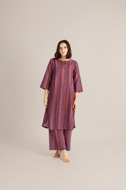 Handwoven line set Woman wearing a striped kurta with pants on a beige background