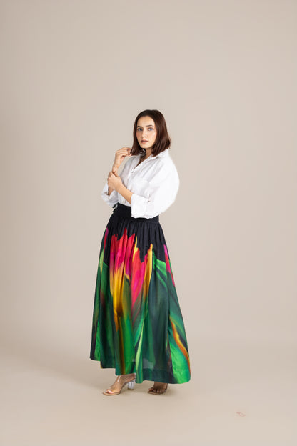 Woman wearing a white blouse and colorful skirt on a beige background