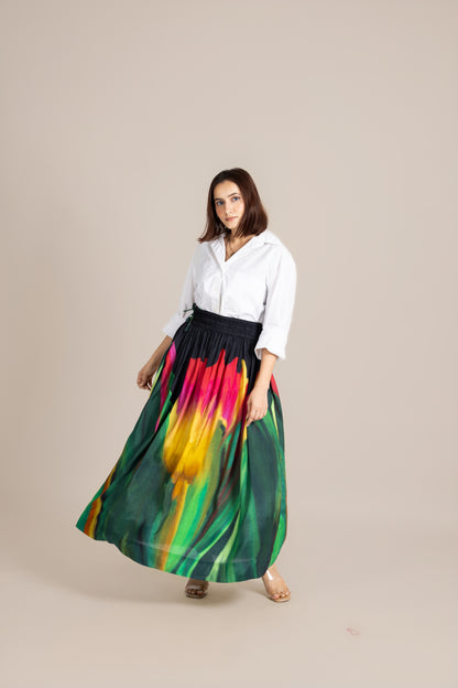 Woman wearing a white blouse and colorful skirt on a beige background