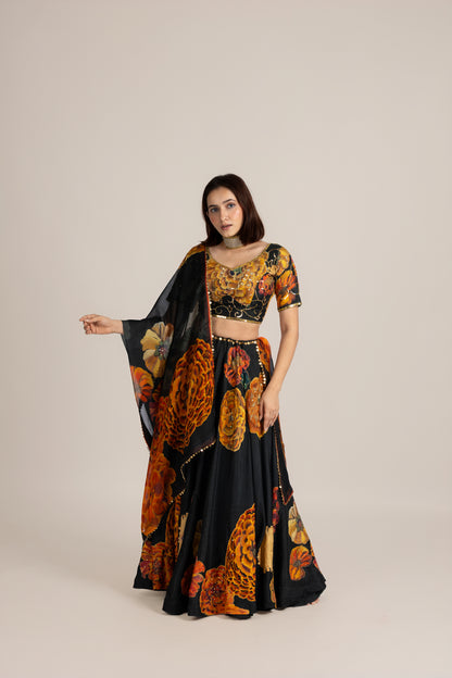 Woman wearing a floral and black outfit on a beige background